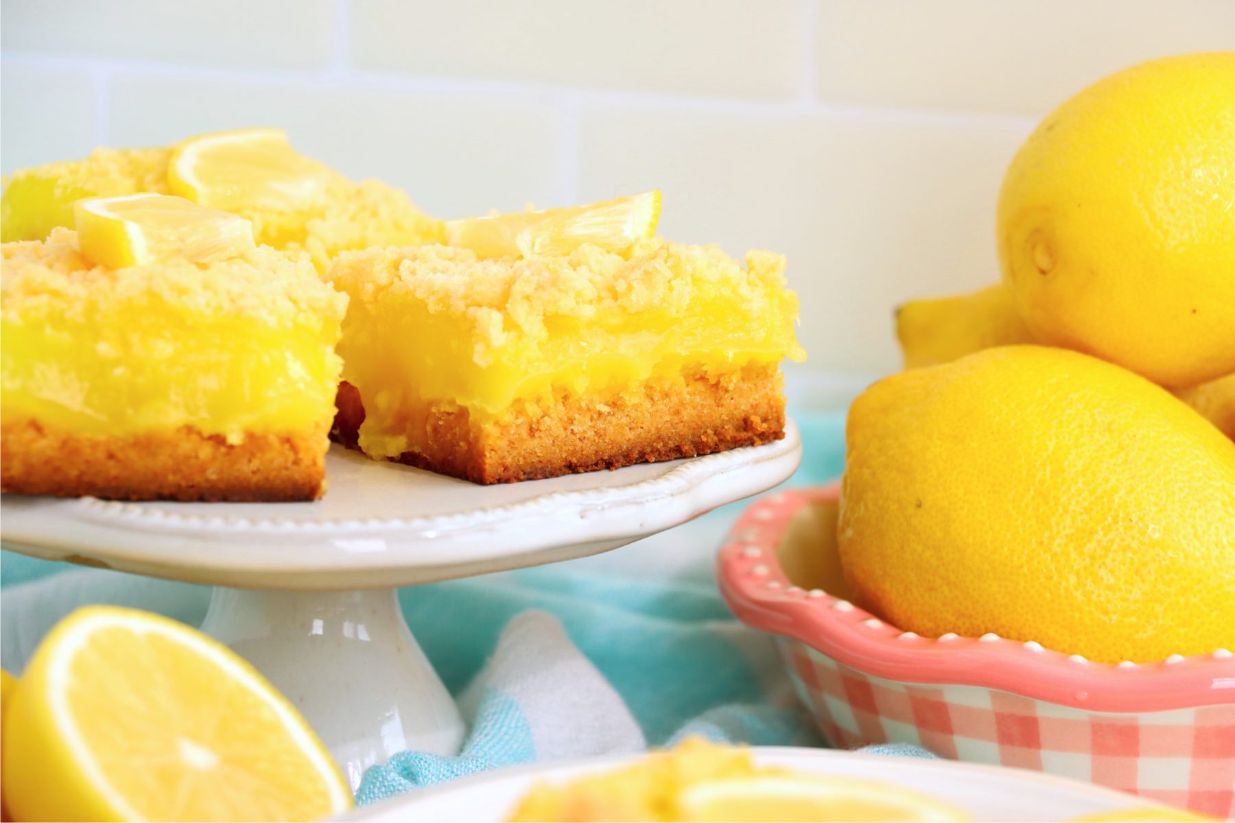 lemon bars on a dessert pedestal
