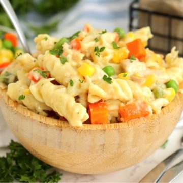 wooden bowl filled with pasta and vegetables