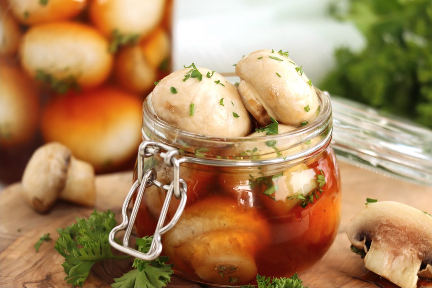 small pint mason jar filled with marinated mushrooms
