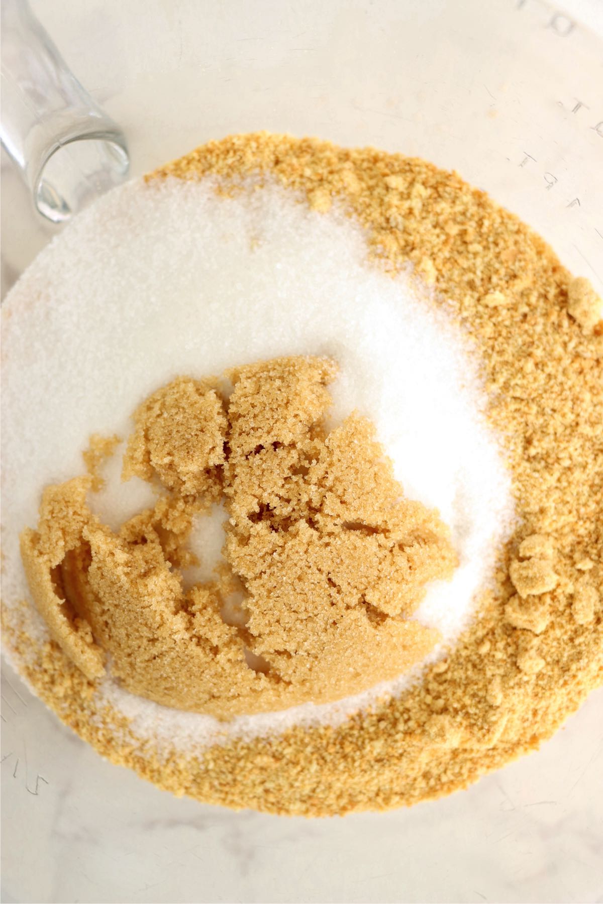Graham cracker crumbs, sugar and brown sugar in a mixing bowl