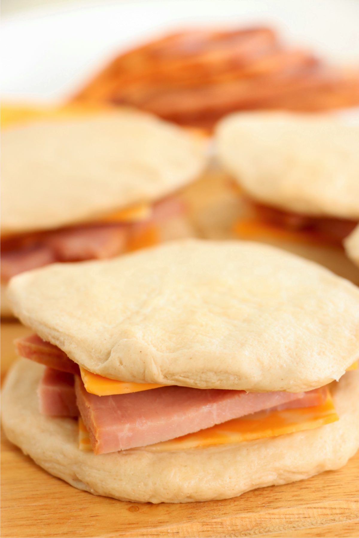 uncooked refrigerated biscuit sandwich filled with ham and cheese