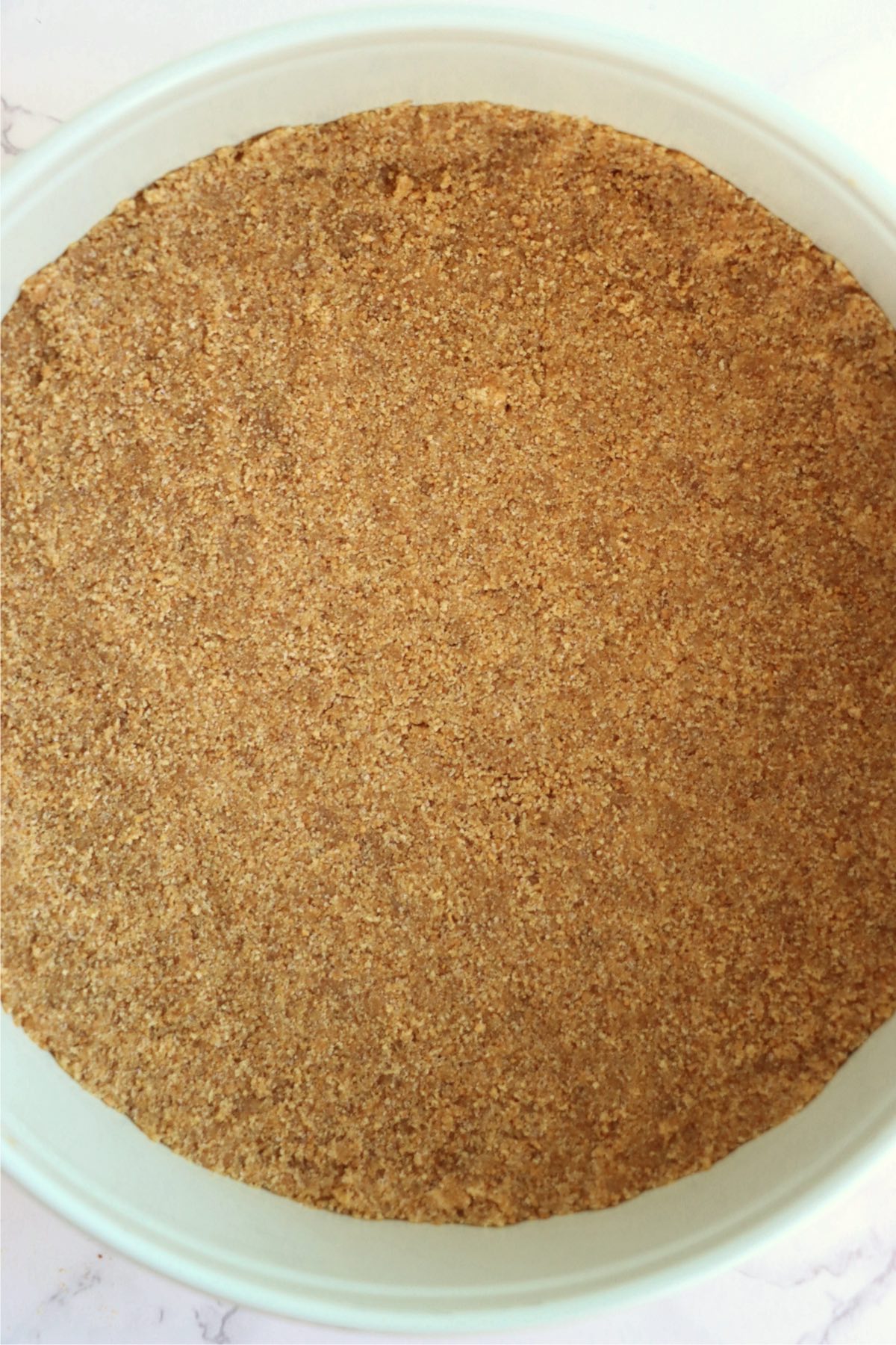 Graham crackers pressed into a crust in a pie pan