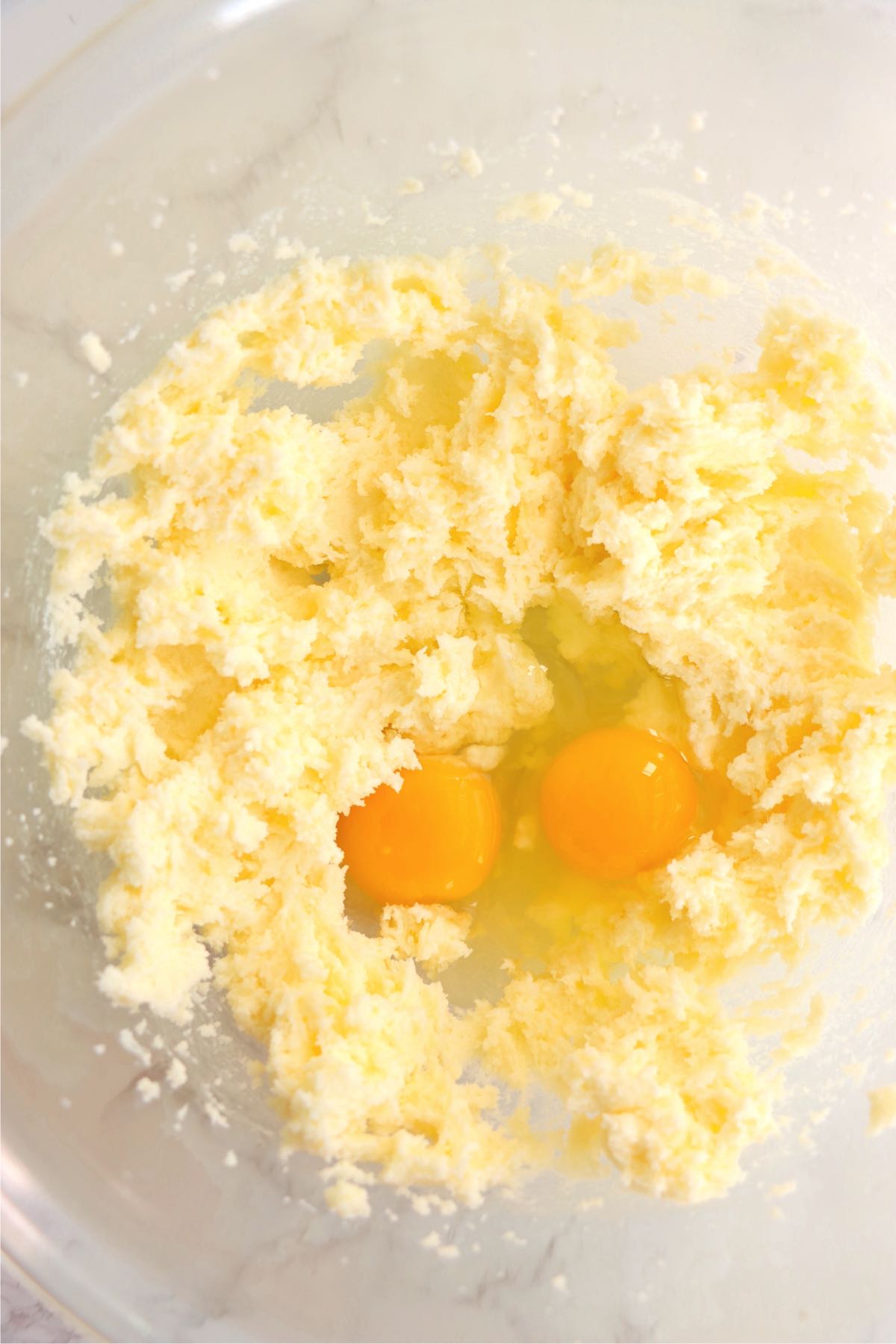 Mixing bowl with butter, sugar and eggs