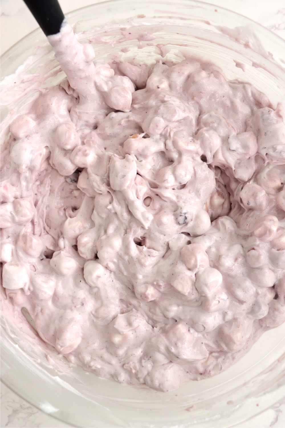 A bowl of blueberry fluff salad with marshmallows