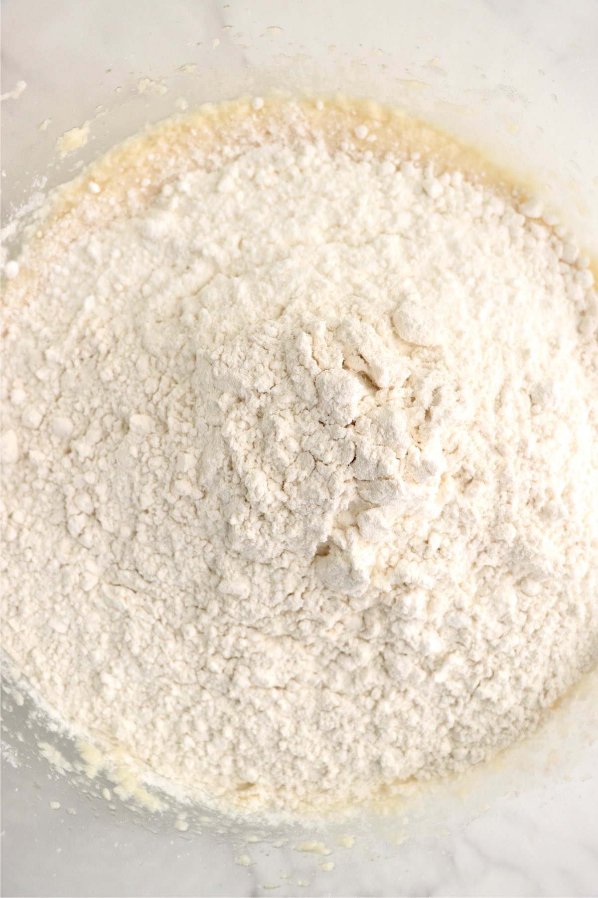 White cake mix and flour in a mixing bowl