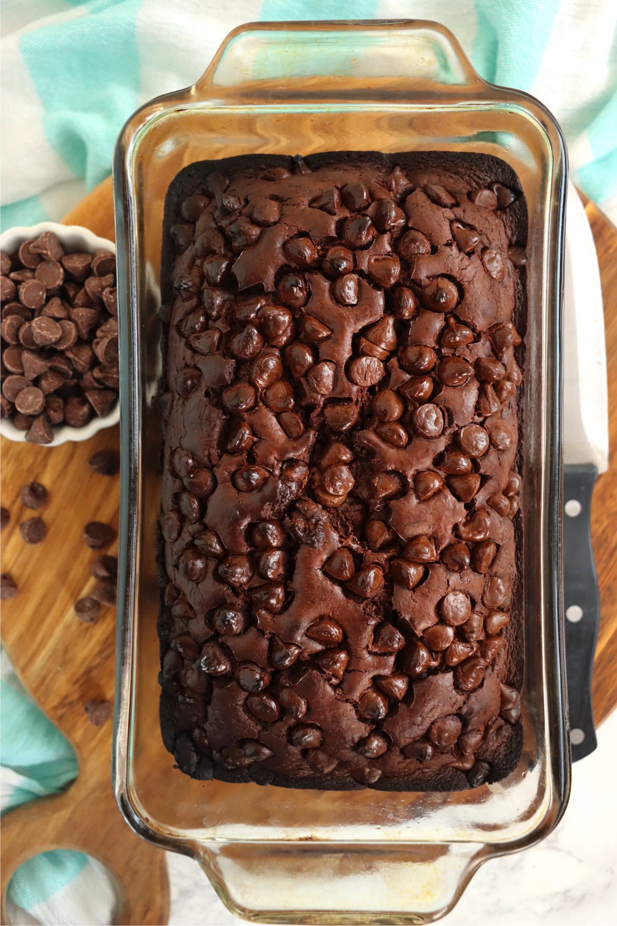 Baked loaf of brownie bread in a glass loaf pan