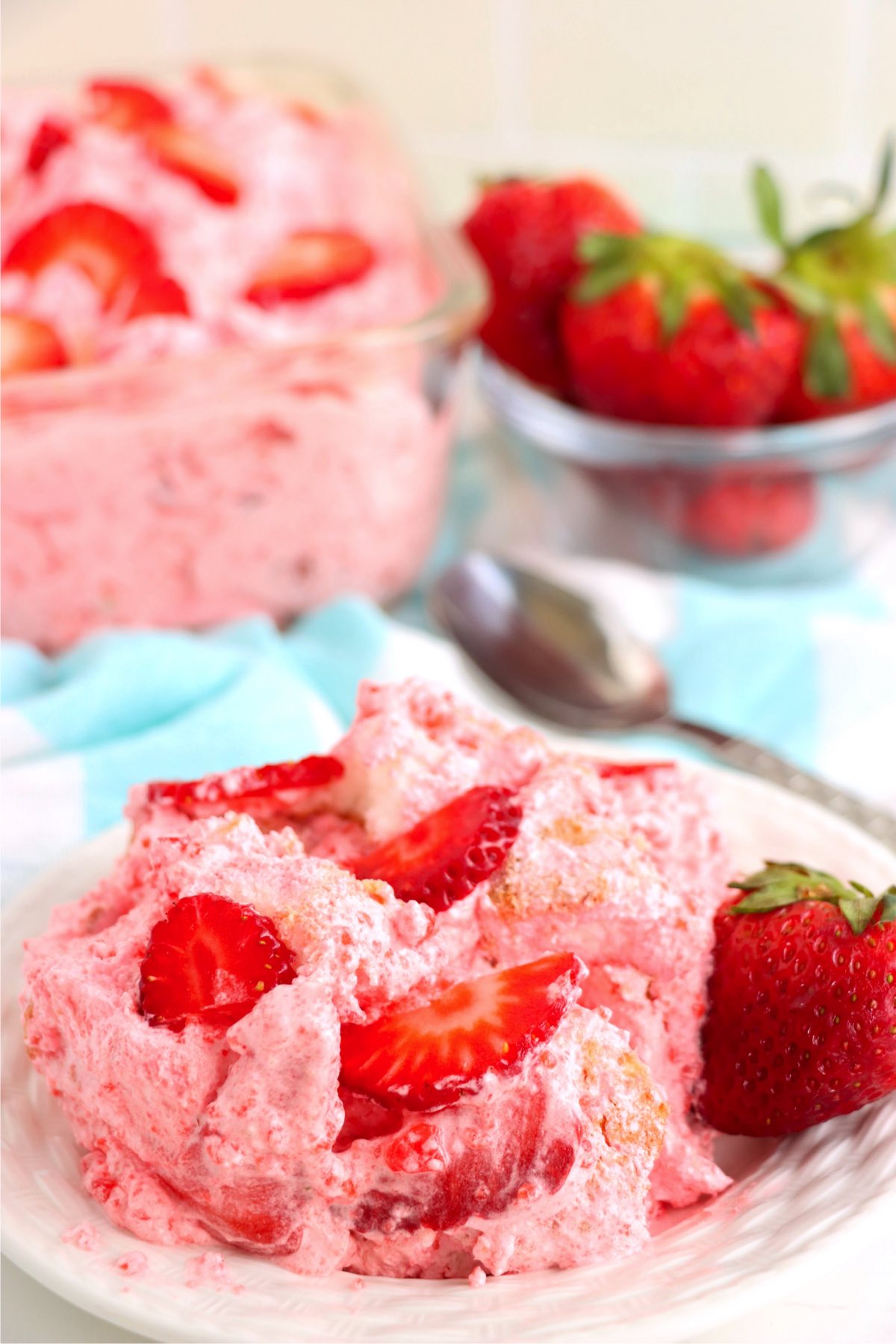 scoopful of strawberry jello dessert on a plate
