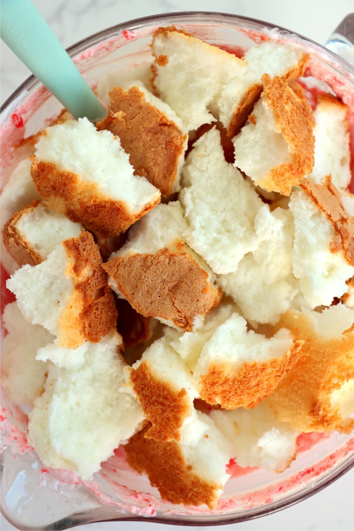 Chunks of angel food cake in a bowl