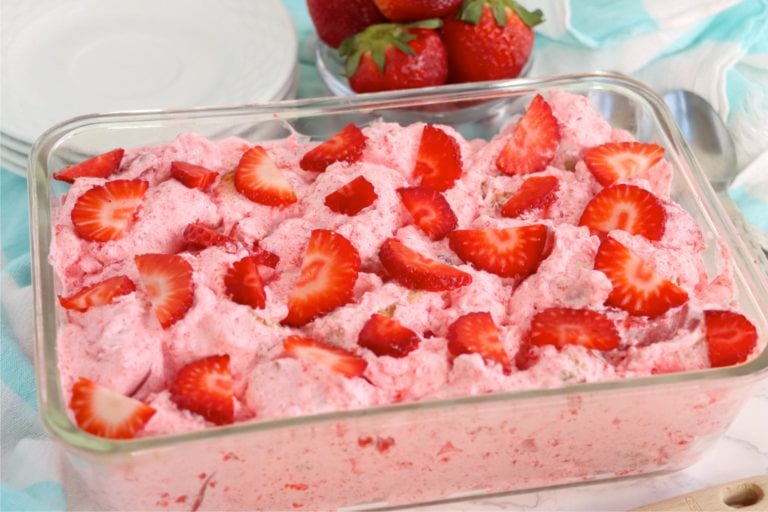 glass baking pan filled with a strawberry fluff dessert
