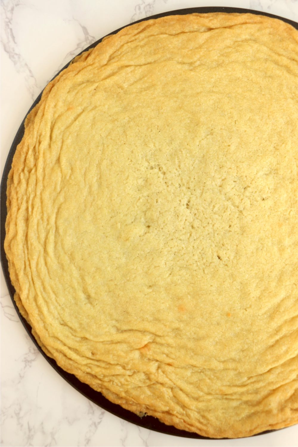 sugar cookie crust on a pizza pan