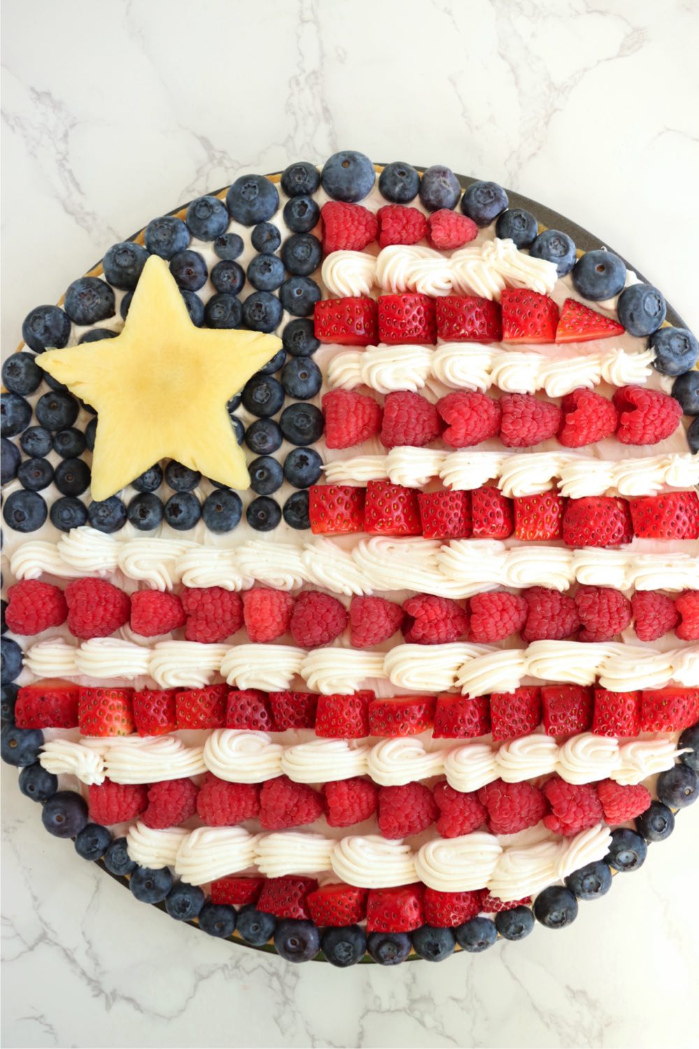 American flag fruit pizza on a white background