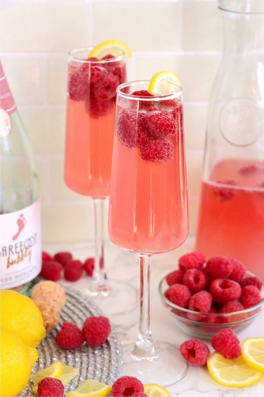 Raspberry mimosas in champagne flutes