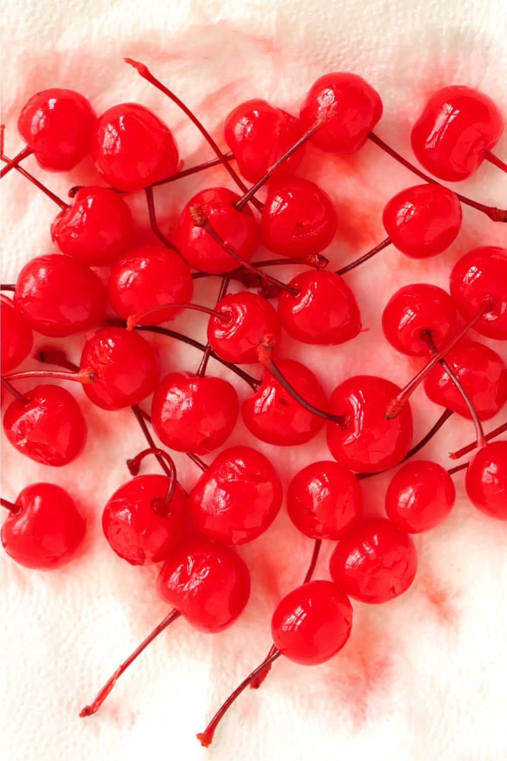 Cherries draining on a piece of paper toweling.