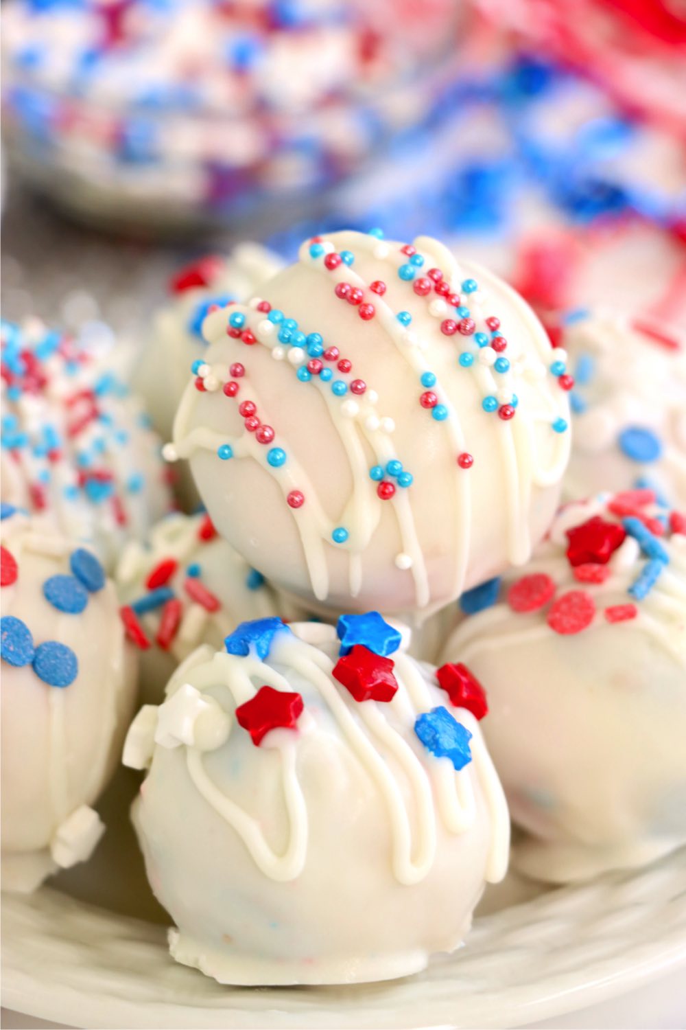 White truffles covered with red, white and blue sprinkles.
