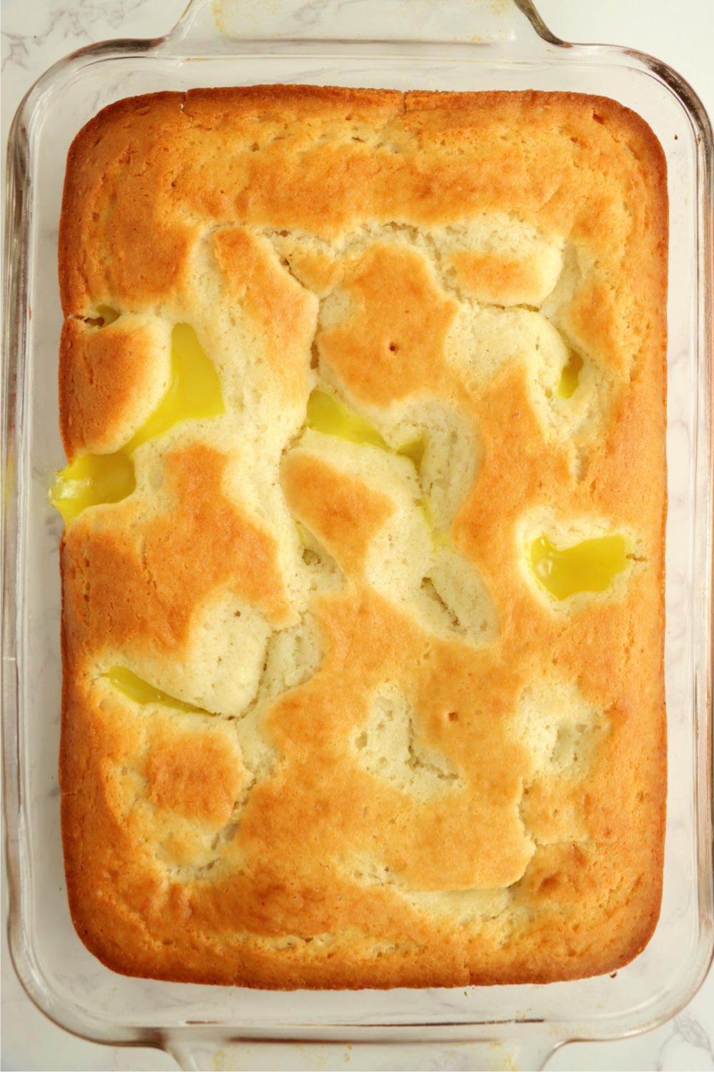 Baked cake with pockets of lemon pie filling.