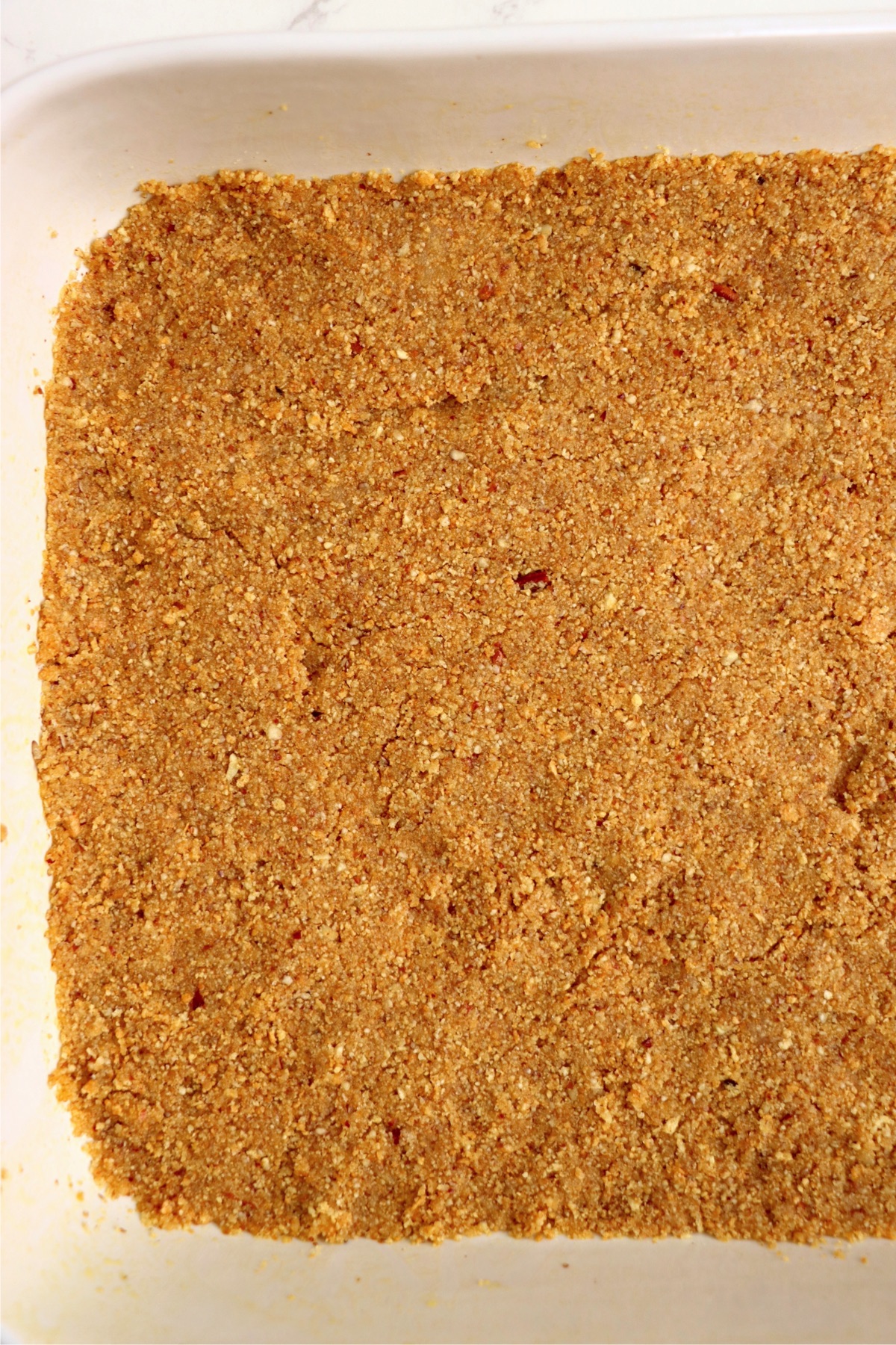 Baked graham cracker crust in a 13x9-inch pan.