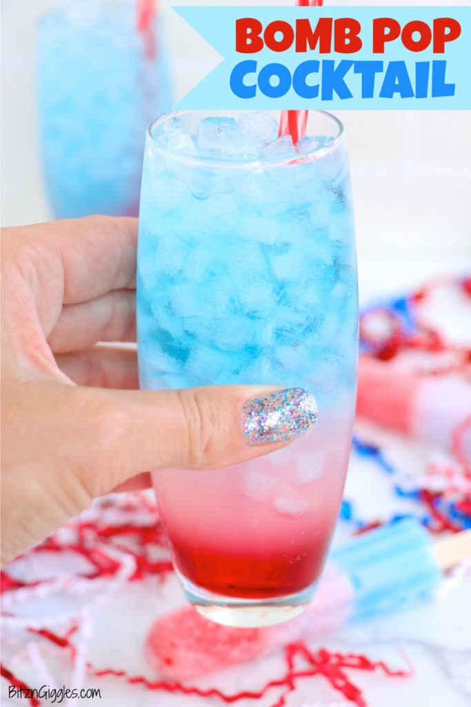 Hand holding a red, white and blue cocktail.