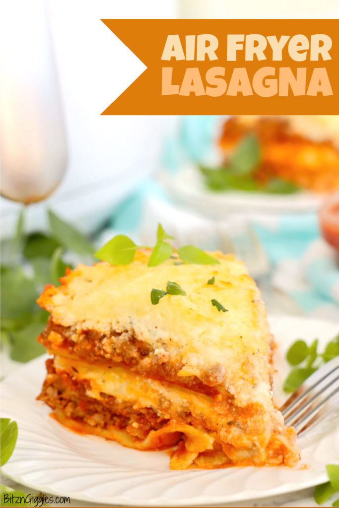 Piece of cheesy lasagna on a white plate in front of an air fryer.