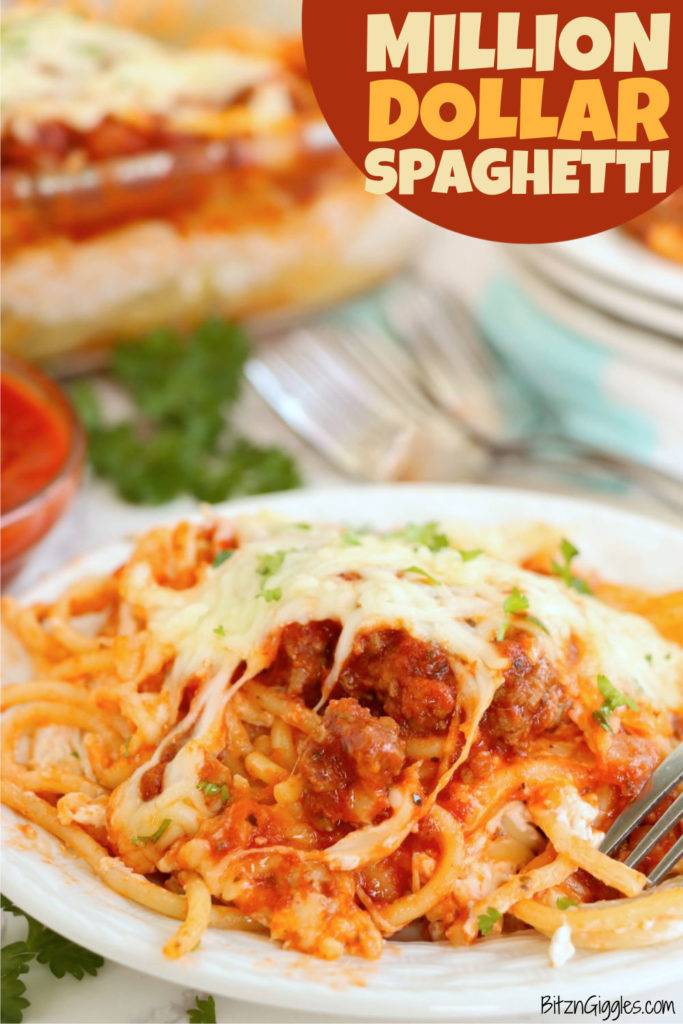 Plate of spaghetti, meat sauce and cheese on a white plate.