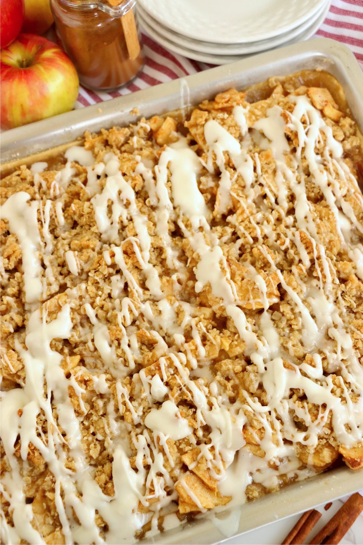 Jelly roll pan filled with iced apple pie.