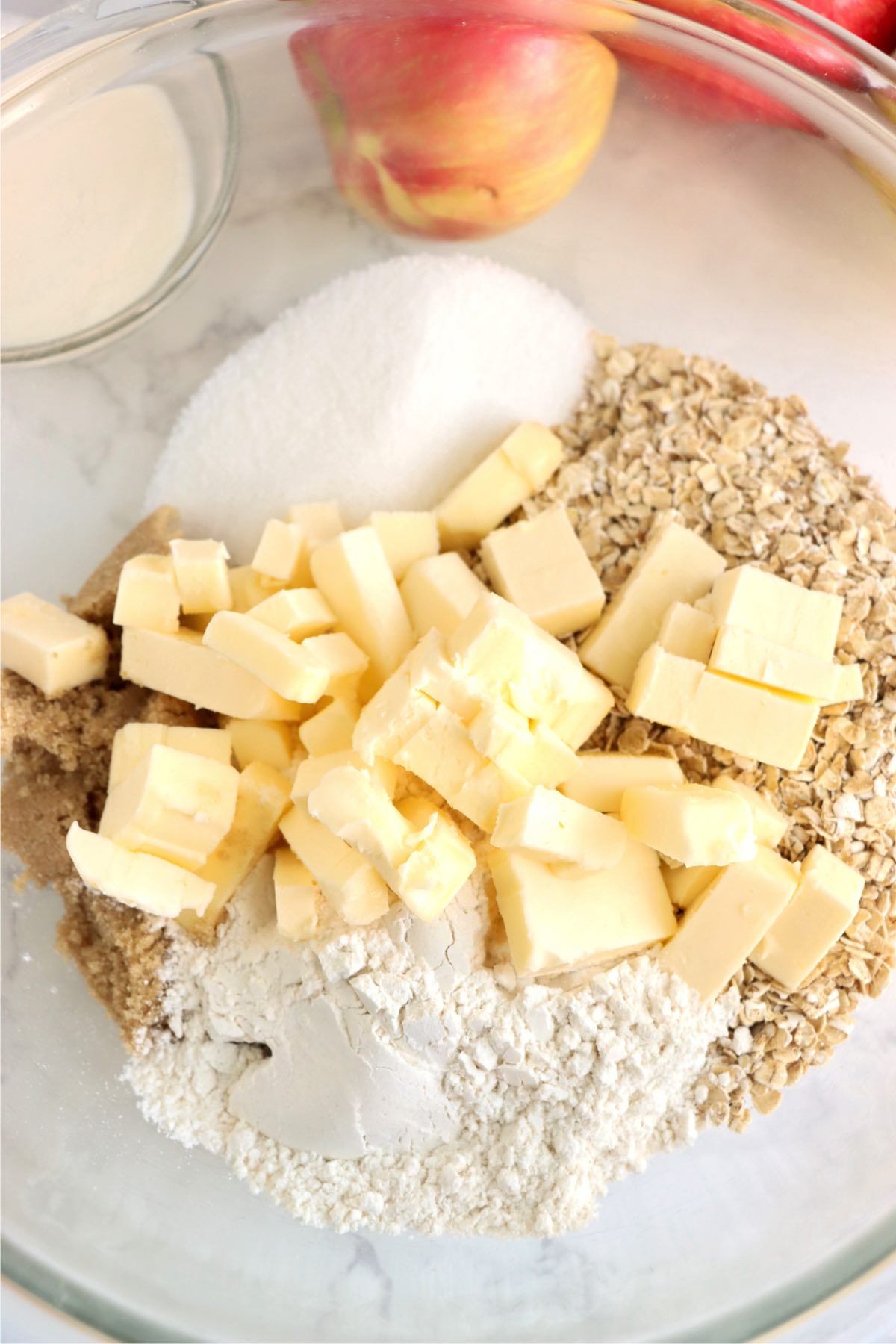 Ingredients for apple pie crust in a mixing bowl.