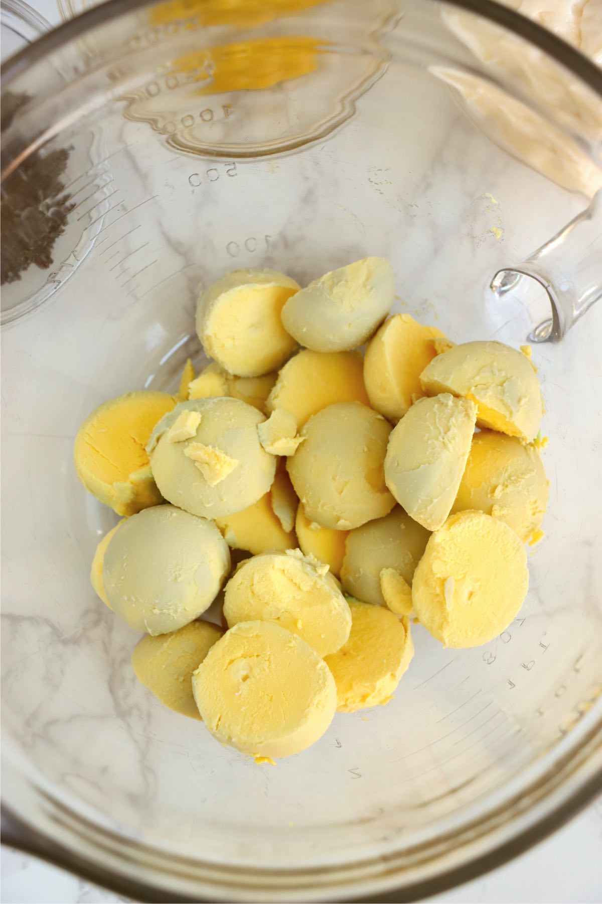 Yolks from hardboiled eggs in a bowl.