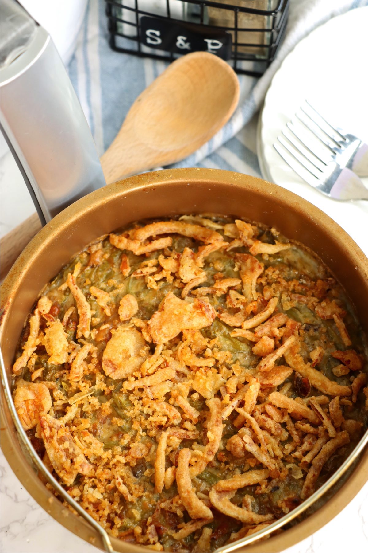 Air-fryer safe bowl filled with green bean casserole.