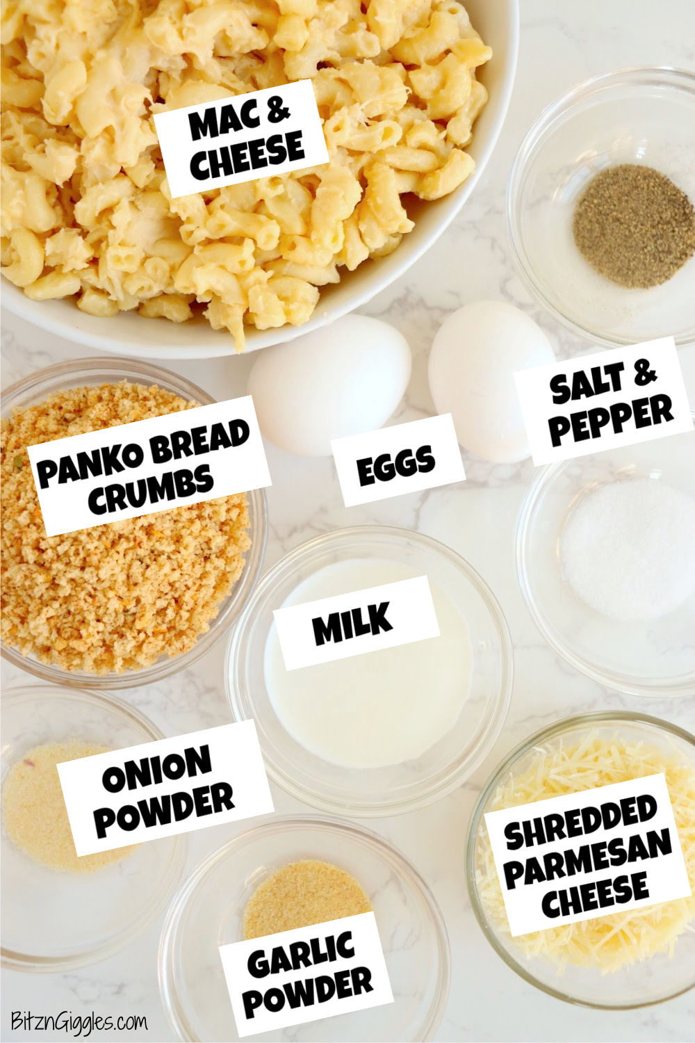 Ingredients for making air fryer mac and cheese bites displayed on a white marble tabletop.