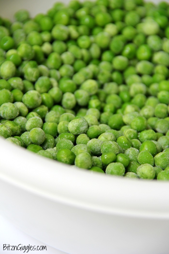 Bowl of peas in white bowl.