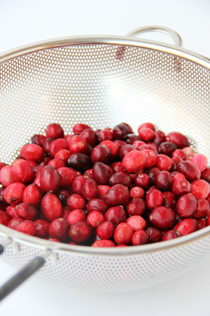 Cranberries in fine mesh strainer.