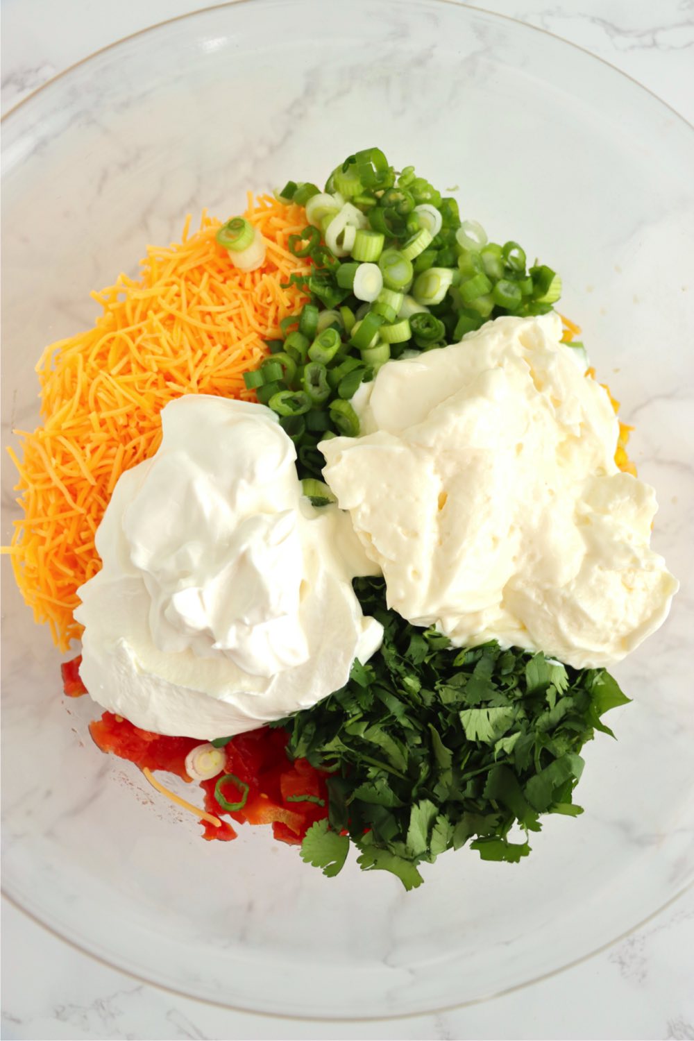 Add mayonnaise and sour cream to dry ingredients for Mexicorn dip recipe.