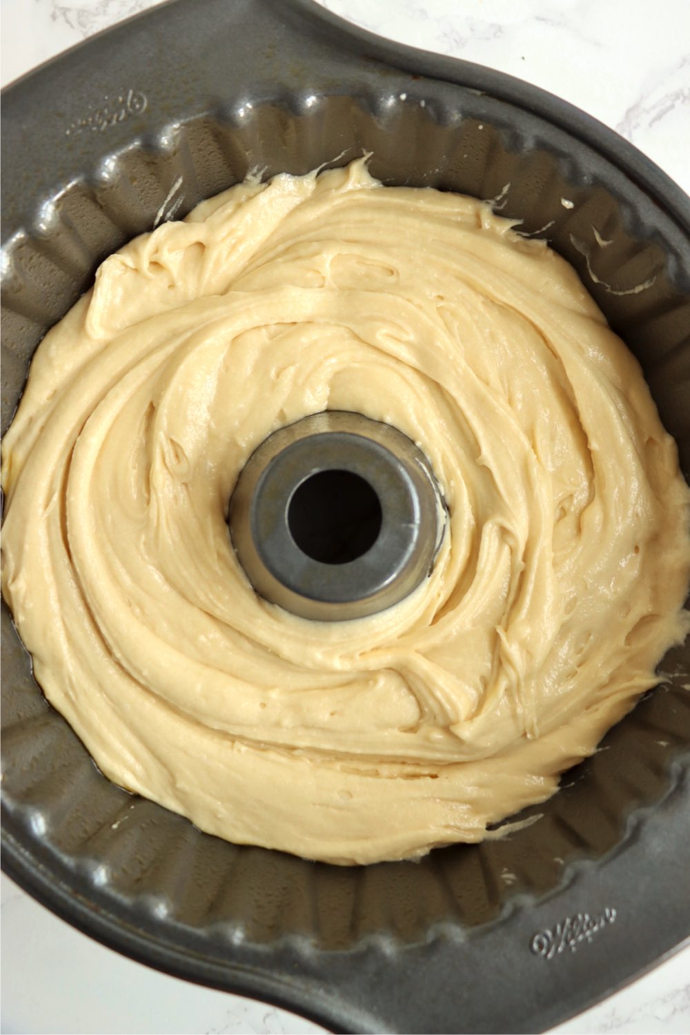 Salted caramel kentucky butter cake mix poured into greased bundt cake.