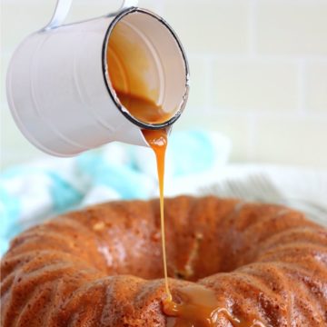 Pouring caramel sauce over salted caramel kentucky butter cake.