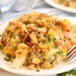A heaping plate filled with colorful veggie casserole.