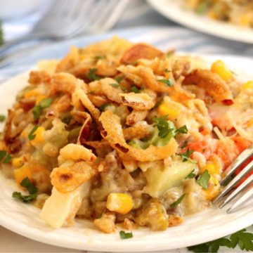 A heaping plate filled with colorful veggie casserole.