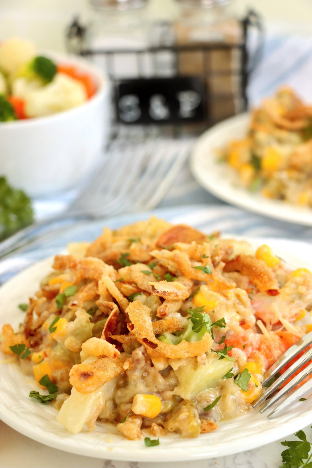 White plate filled with a baked vegetable casserole.