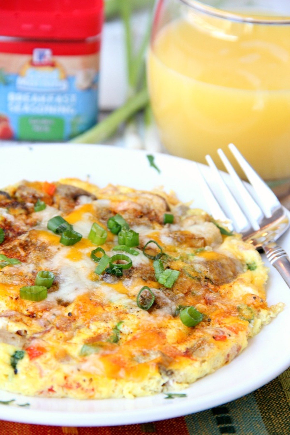 Air fryer omelette on white plate with fork.