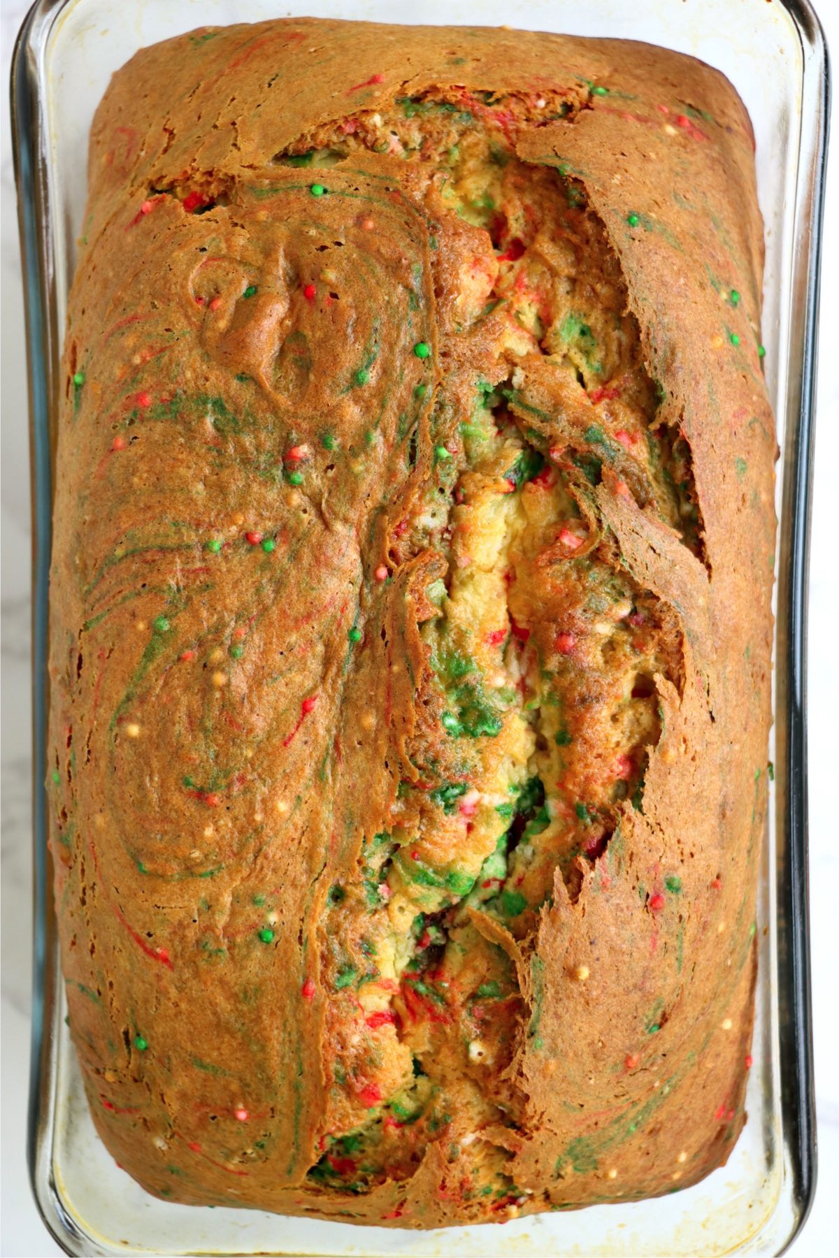 Baked loaf of red and green sprinkle bread for Christmas.