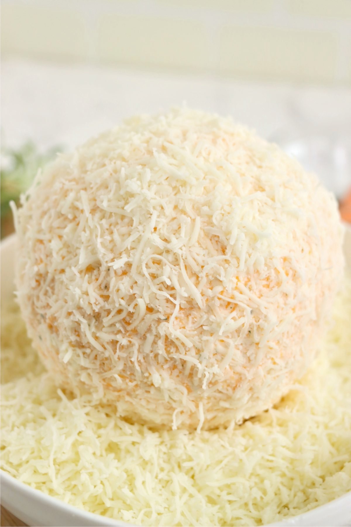 Cheese ball rolled in Monterey Jack cheese.