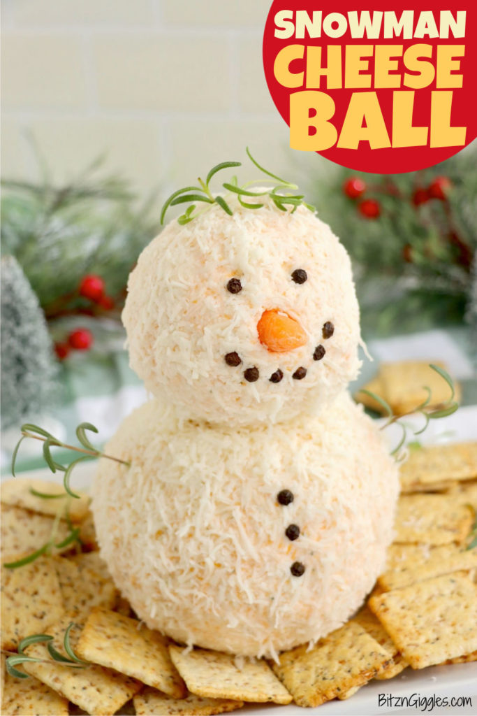 Cute snowman cheeseball appetizer for the holidays surrounded by crackers.