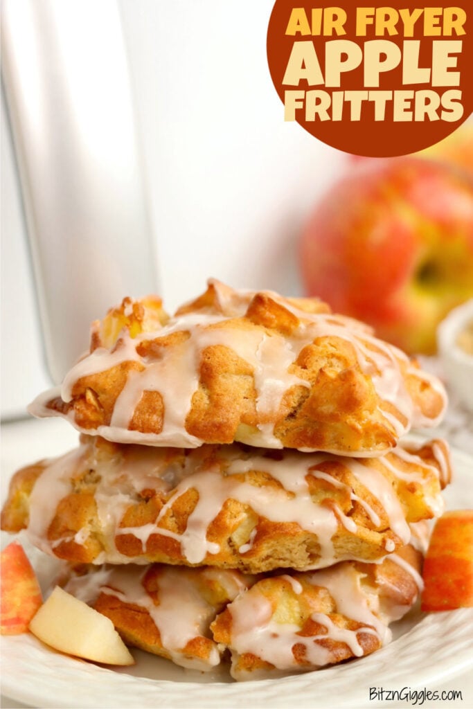 A stacked of iced apple fritters in front of an air fryer.