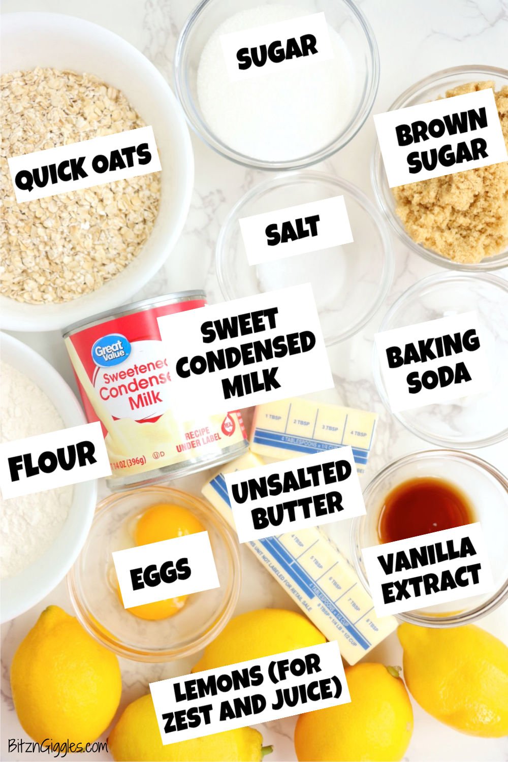 A top-down view of the key ingredients for lemon crumb bars, including oats, flour, brown sugar, sweetened condensed milk, lemons, and butter.