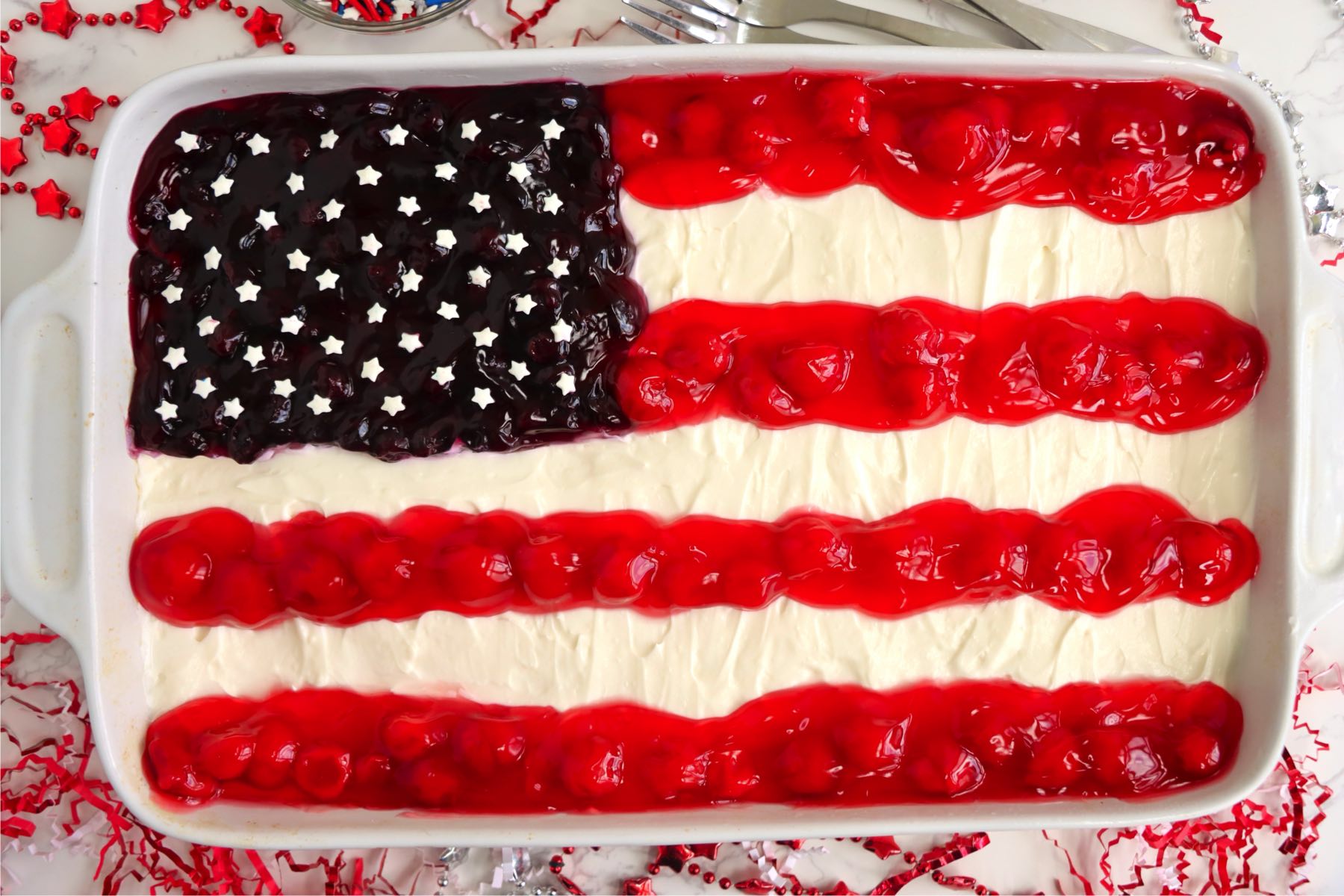 Cheesecake in a baking dish with a flag design.
