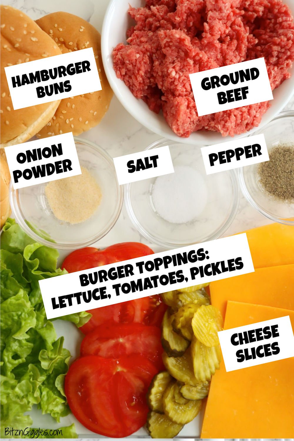 Ingredients for burgers are laid out on a white surface, including raw ground beef, spices, buns, cheese, lettuce, tomato, and pickles.