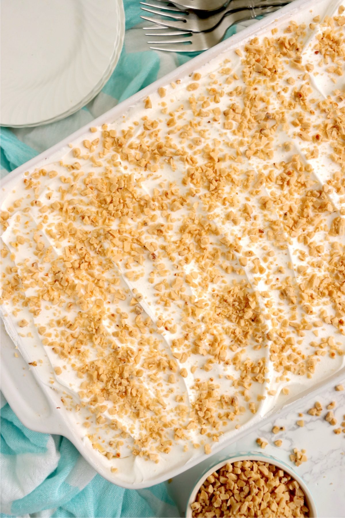 Crushed toffee bits sprinkled over the whipped topping in the final step.