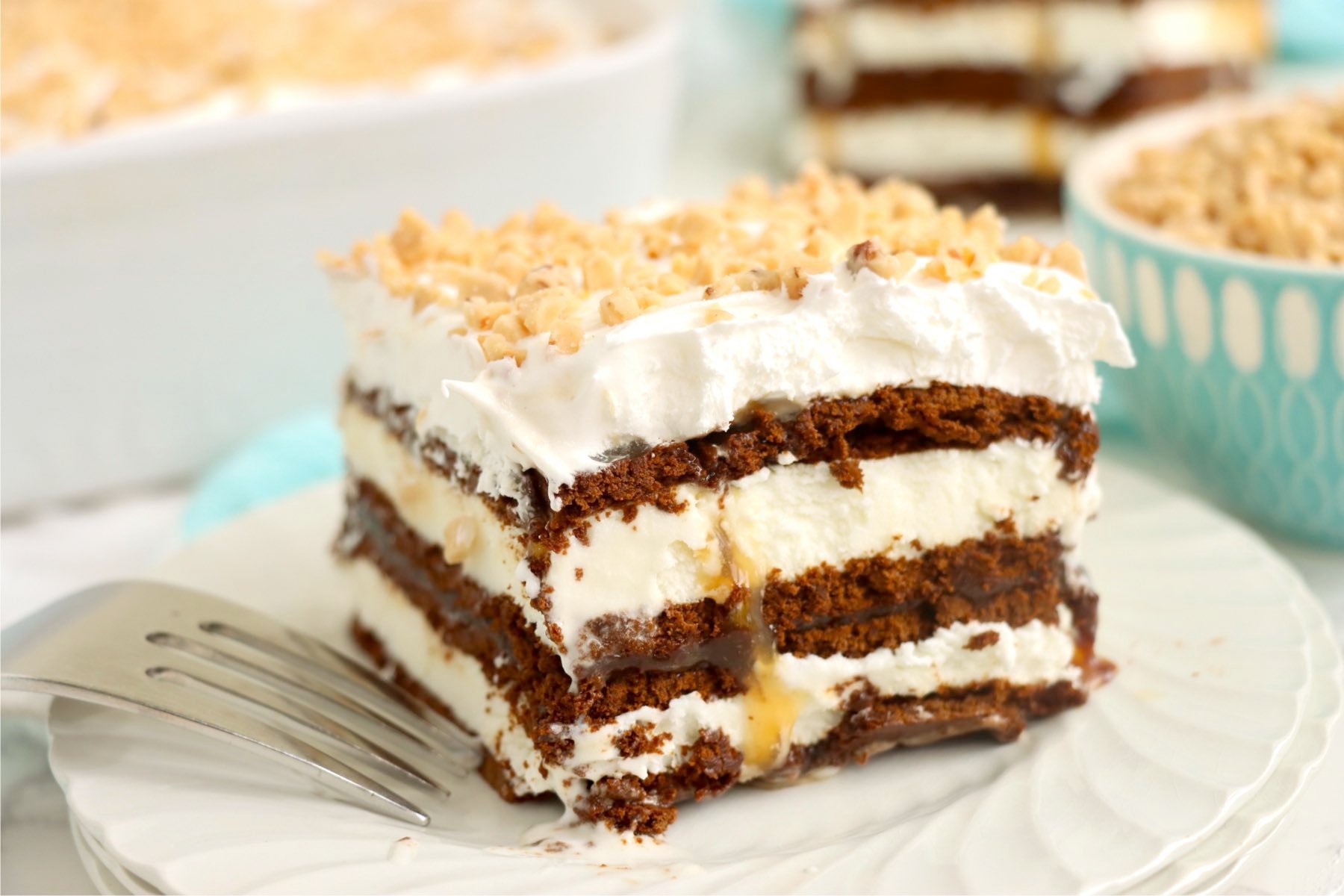 A single plated slice of the ice cream sandwich dessert with a fork nearby.