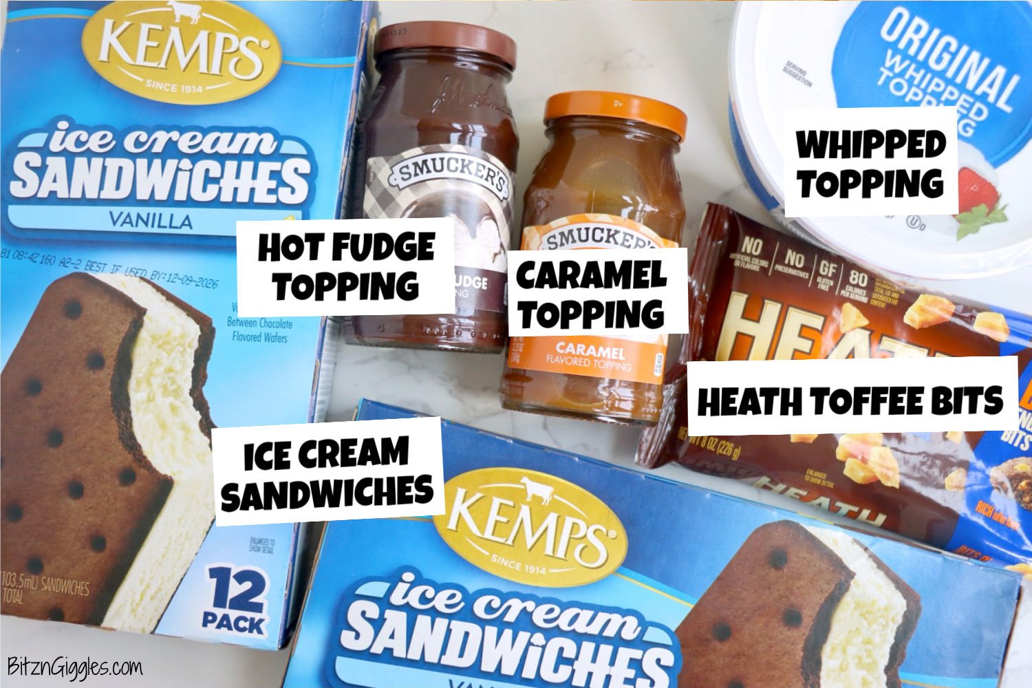Ingredients for an ice cream sandwich cake laid out on a white table.