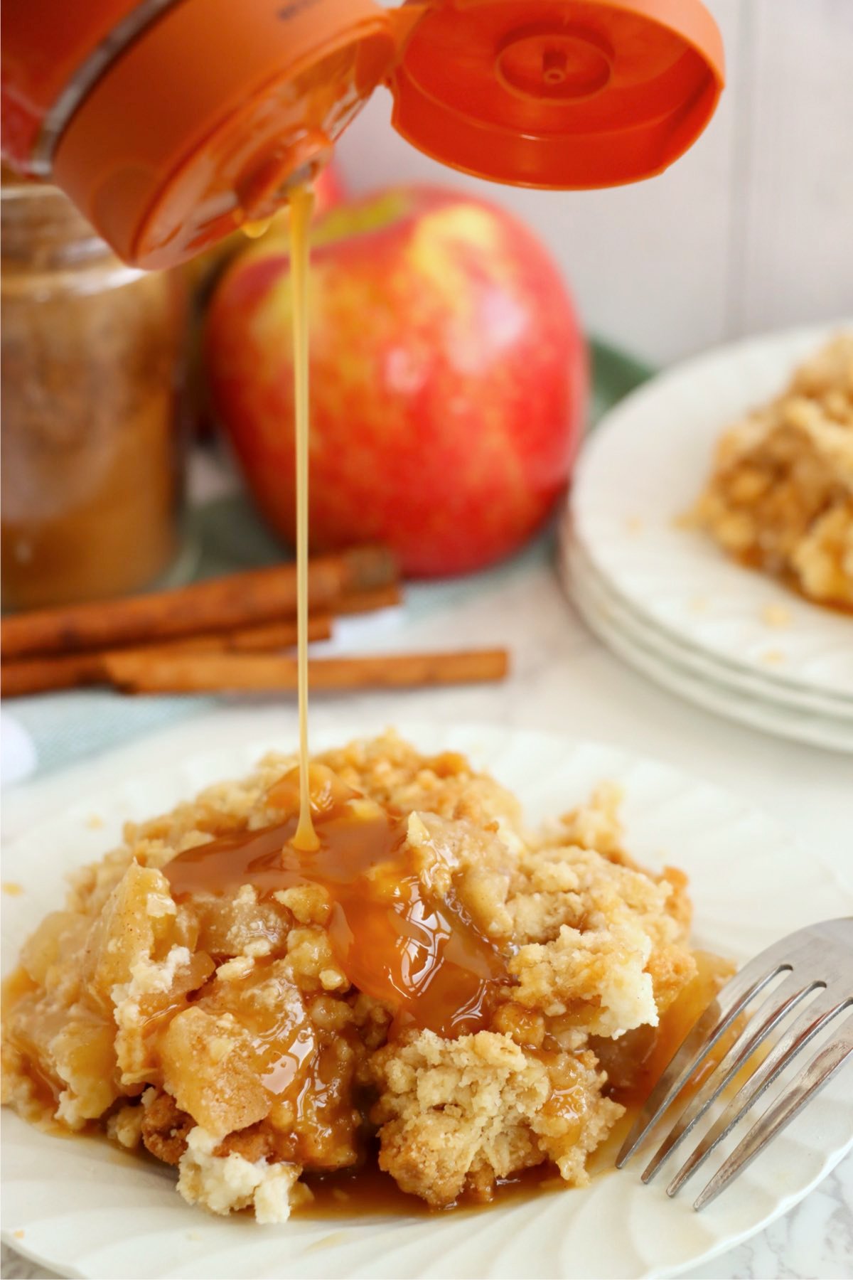 Warm dessert on a plate drizzled with caramel sauce, ready to serve.