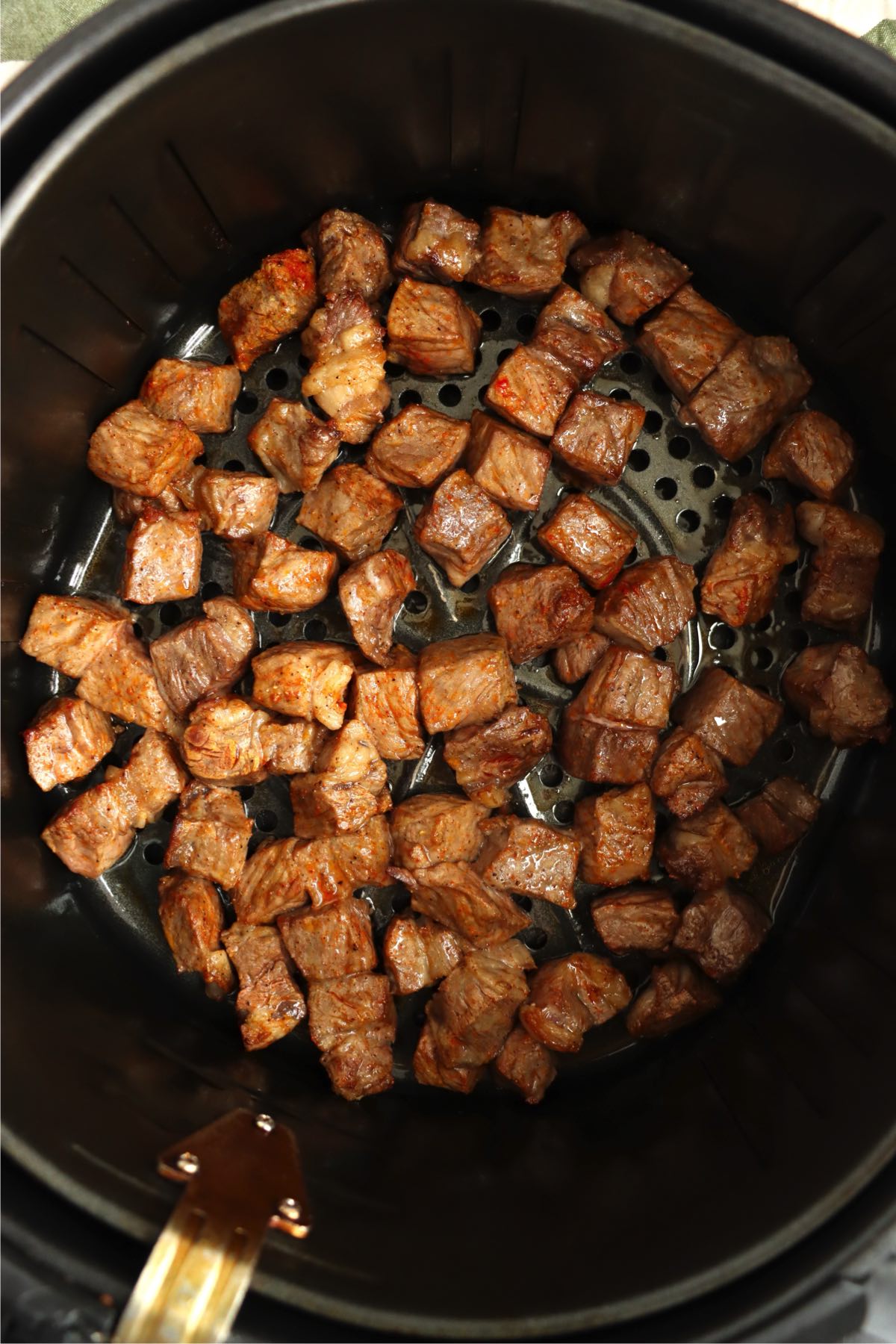 Steak bites cooked in the air fryer until browned and tender.
