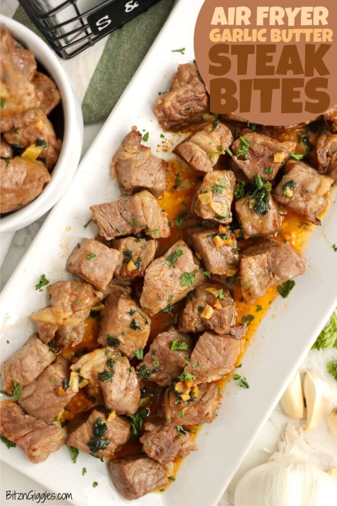 Air fryer garlic butter steak bites on a white platter.